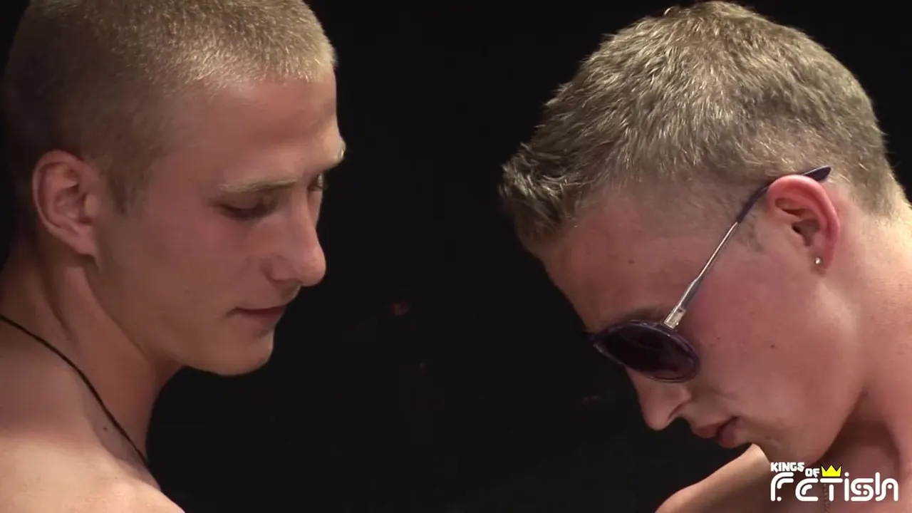 Muscular guy with sun glasses and his friend blow each other with passion